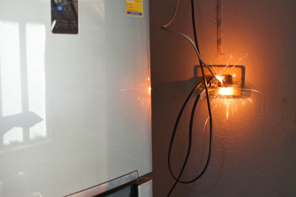 Electrical plug sparking and burning from a short circuit, a dangerous defective product