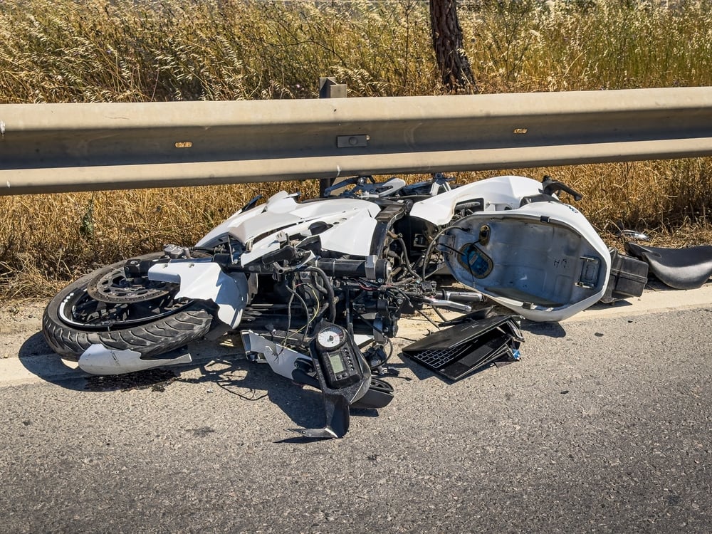 Motorcycle and a damaged car after a highway traffic accident in South Carolina